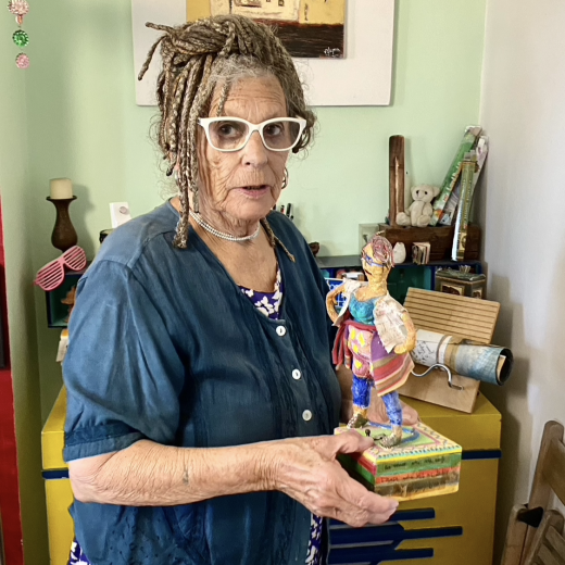 Artist Trish Flynn with her own work 